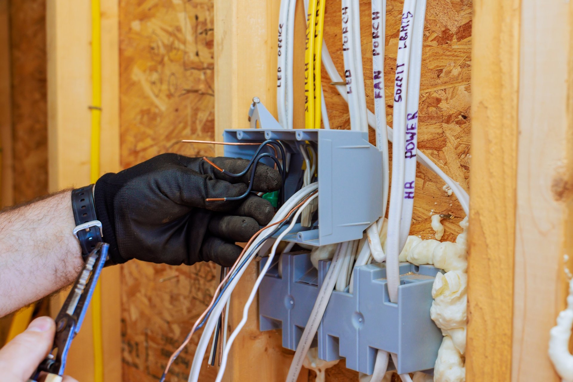Professional electrician working on electrical panel